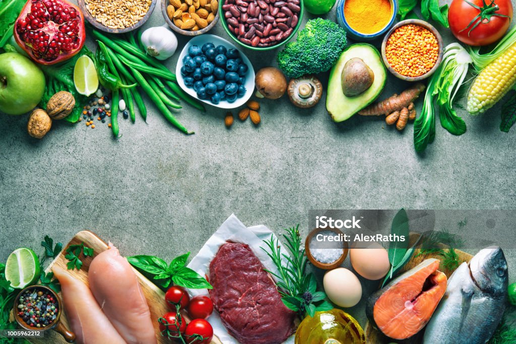Balanced diet food background Balanced diet food background. Organic food for healthy nutrition, superfoods, meat, fish, legumes, nuts, seeds and greens Vegetable Stock Photo