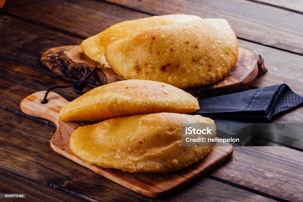 Fried empanadas, stuffed with chicken and meat Fried empanadas, stuffed with chicken and meat, Typical breakfast in Latin American countries Empanada Stock Photo