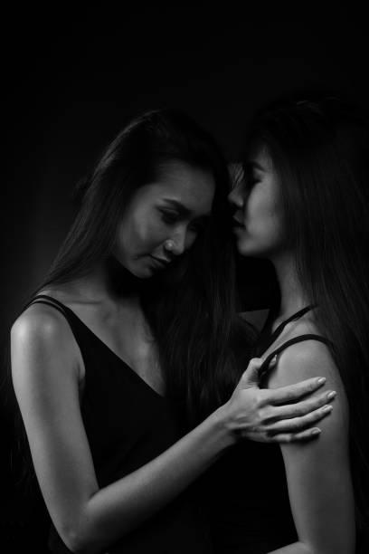 istock desperate woman try to touch each other to understand feeling down 1005975374