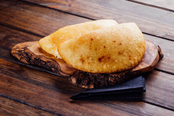 istock Fried empanadas, stuffed with chicken and meat 1005978328