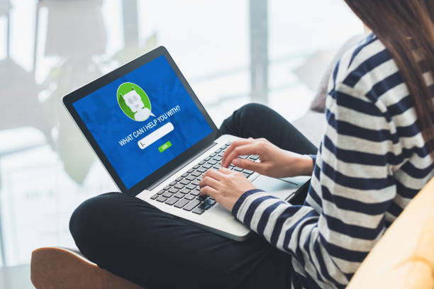 istock Asia woman ask chat bot function in app on laptop screen looking for customer support online shopping shop with apps,digital marketing concept,artificial intelligence (ai) system 1005978404