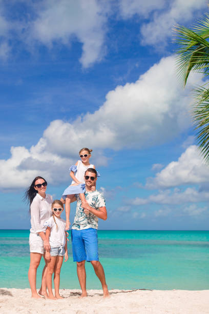 istock Happy beautiful family on the beach 1005983498