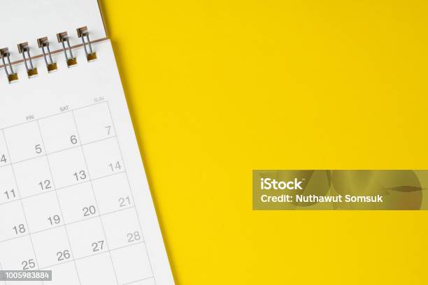 White Clean Calendar On Solid Yellow Background With Copy Space Business Travel Or Project Planning Concept Stock Photo - Download Image Now