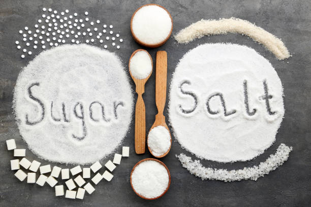 Inscription Sugar and Salt on grey wooden table