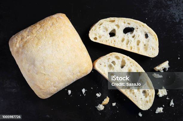 Loaves And Slice Of Ciabatta Stock Photo - Download Image Now - Bun - Bread, Ciabatta, Baked