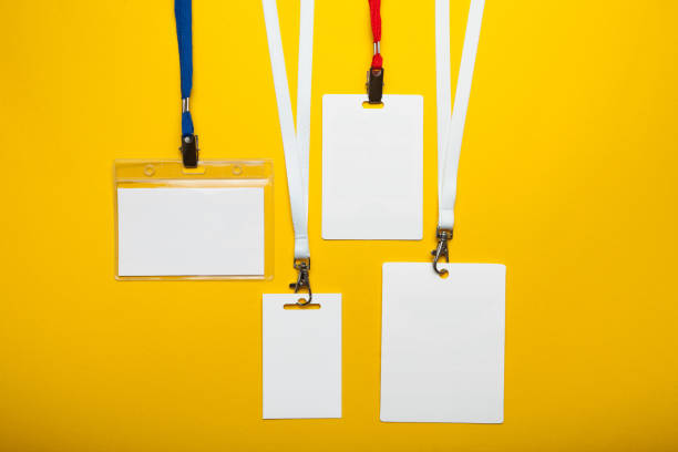 istock Empty set of ID badge isolated on yellow background 1005988044