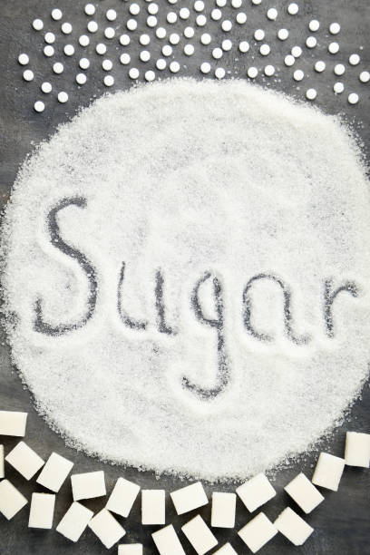 istock Different kinds of sugar with inscription Sugar on grey wooden table 1005988242
