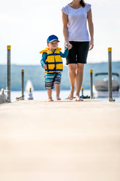 istock Mother and Son Looking at the View on Pier in Summer 1005991284