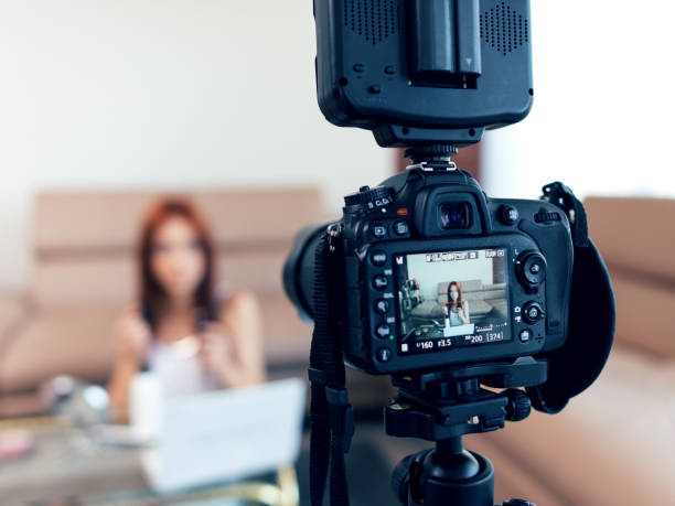 istock Young female vlogger recording a make-up video for her vlog. 1006002238