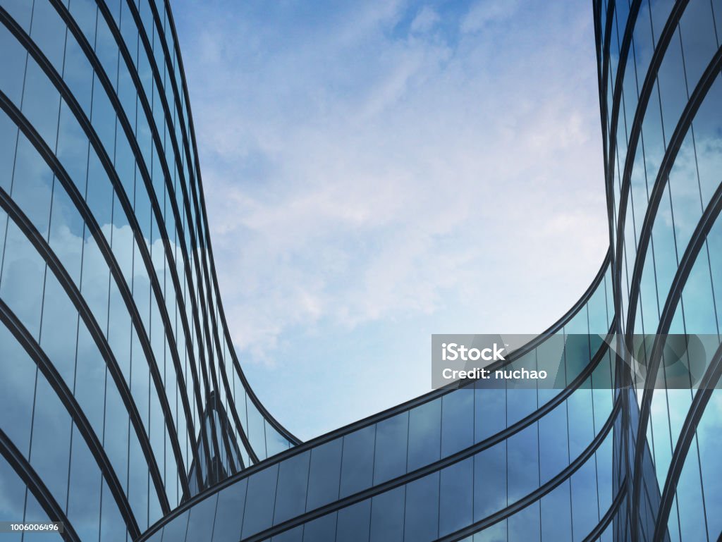 Perspective of high rise building and dark steel window system with clouds reflected on the glass.Business concept of future architecture,lookup to the angle of the building corner. 3d rendering Architecture Stock Photo