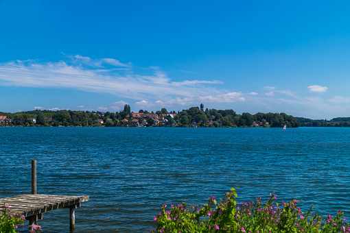 The ploener see in Germany. Take a look over the lake to the town of ploen.