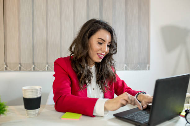 istock Beautiful girl in the office 1006023494