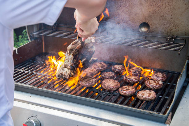 istock Lamb joint and burgers on a barbecue 1006023728