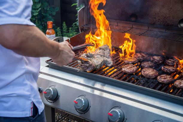 istock Lamb joint and burgers on a barbecue 1006023734