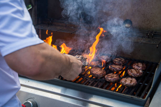 istock Lamb joint and burgers on a barbecue 1006023746