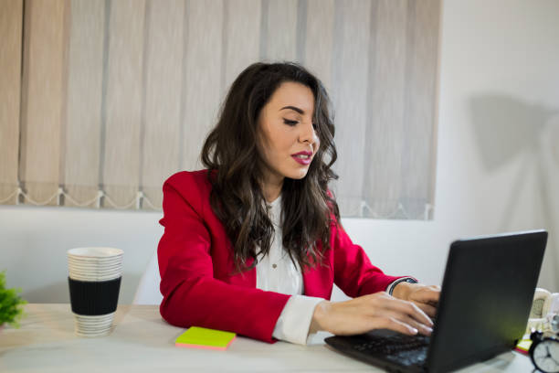 istock Beautiful girl in the office 1006030448