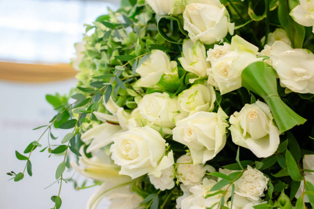 istock Many white flowers in the hall. 1006044514
