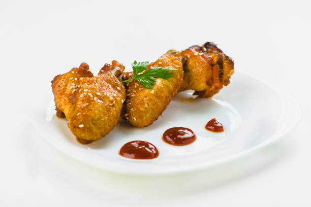 istock chicken wings with sesame on white background 1006045750