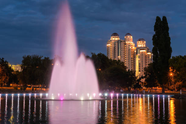 istock evening city pond with fountain 1006045960