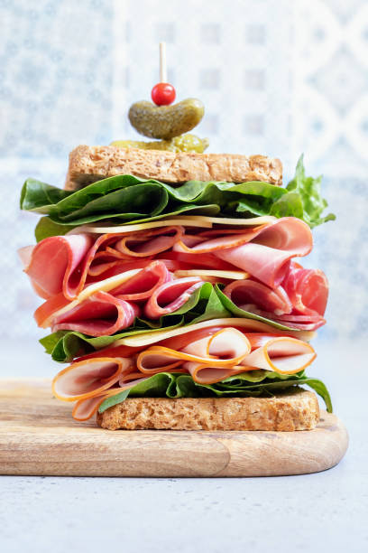 istock Big sandwich with ham, deli meat and vegetables 1006048690