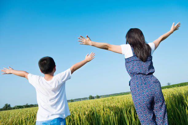 istock Mother and son in a rice field 1006053992