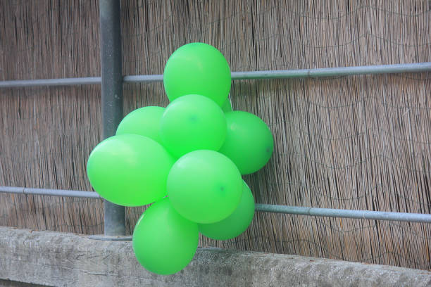 istock hanging green balloons 1006056942