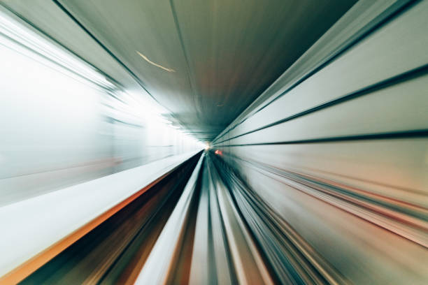 istock speed motion blur on transportation, blue light in perspective line. 1006058232