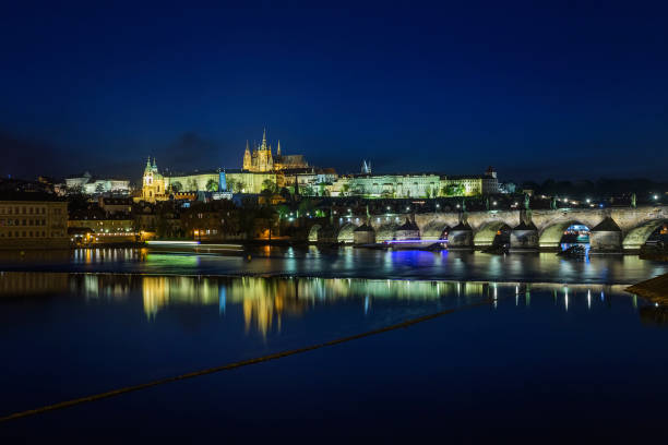 istock Prague Castle and Charles Bridge at night, blue sky and river, Czech republic 1006058832