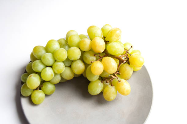 istock Ripe grape on concrete plate close-up 1006062314