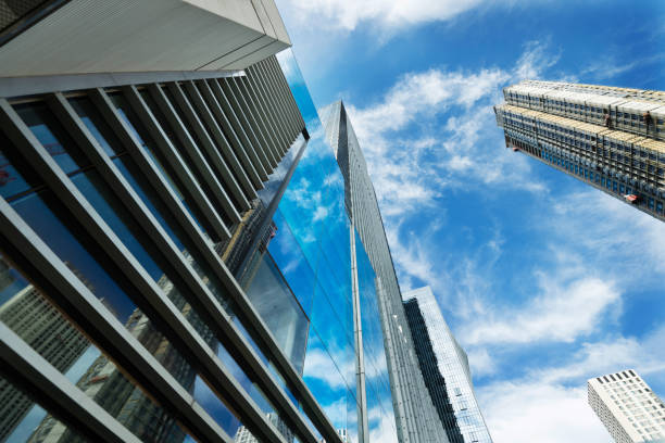 istock Looking up of modern office buildings 1006062924