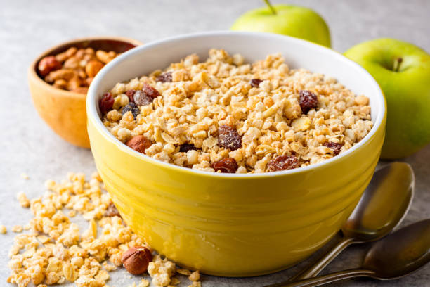 istock Granola and muesli in bowl on gray stone background 1006063776