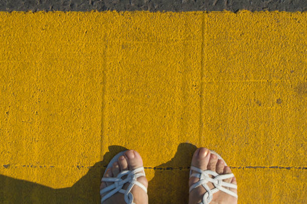 istock Female legs on the pavement with copy space outdoors 1006074730