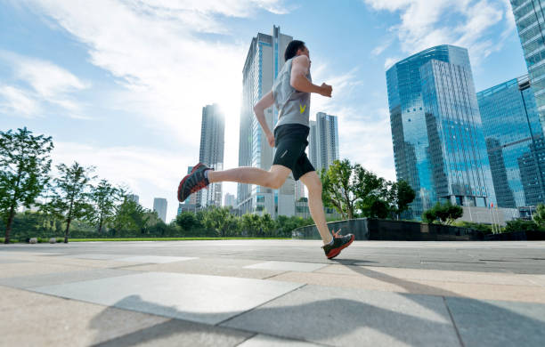 istock Man running in city street 1006076712