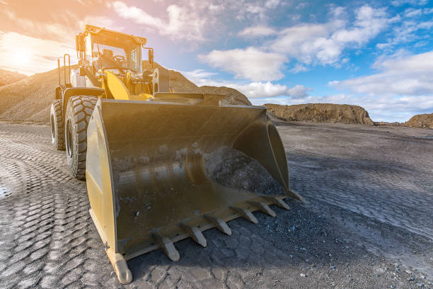 istock Excavator collecting stone in an open-cast mine 1006081624