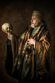 istock Hamlet by William Shakespear holding skull in his hands 1006082734