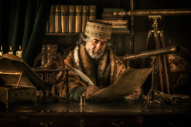 астроном пишет на пергаменте пером - стиль 18 века стоковые фото и изображения