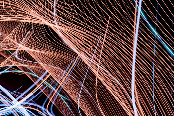 istock Abstract light lines on black background. Light trails against dark background. 1006085402