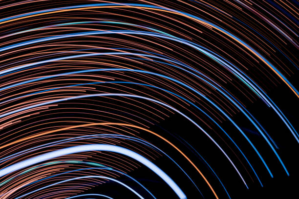 istock Abstract light lines on black background. Light trails against dark background. 1006085410