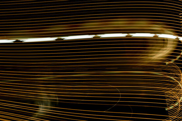 istock Abstract light lines on black background. Light trails against dark background. 1006085446