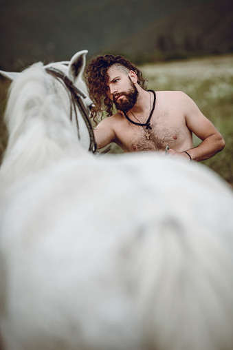 Male Horse Trainer And Horse Bonding During Training Session