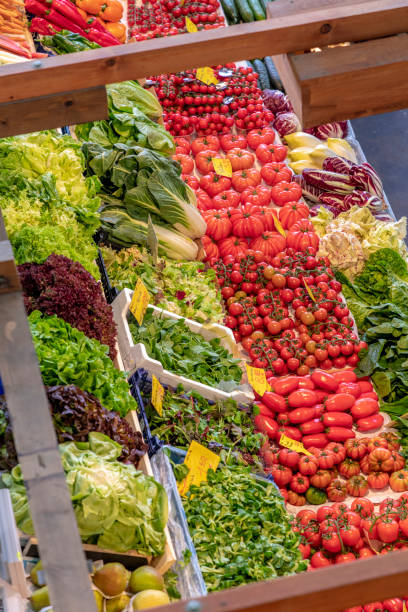 istock fresh vegetables, salad, onions tomatoes offered at the Kleinmarkthalle 1006089114