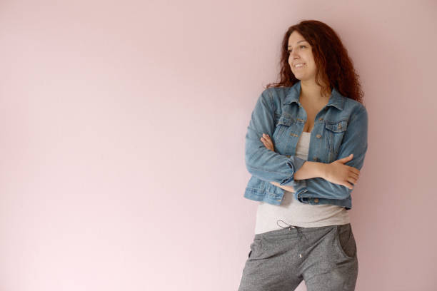 istock Beautiful girl on the pink background 1006098406