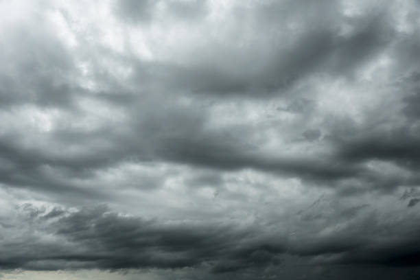 istock Motion of dark sky and black clouds, Dramatic cumulonimbus cloud 1006098710