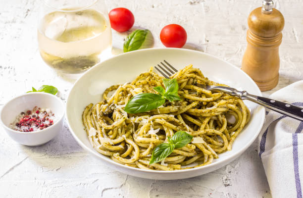 istock Spaghetti with homemade pesto sauce 1006098724