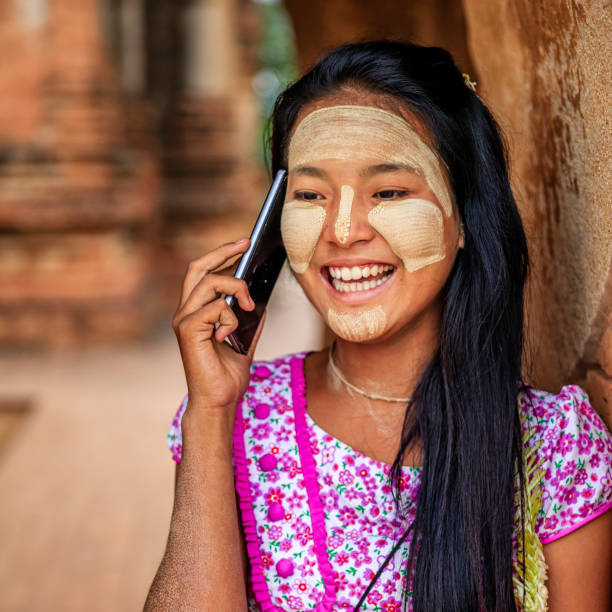 istock Young Burmese girl using a mobile phone in Bagan, Myanmar 1006102240