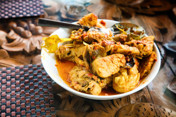Indonesian Stewed Chicken Ayam Goreng dish ready to serve on tabletop.