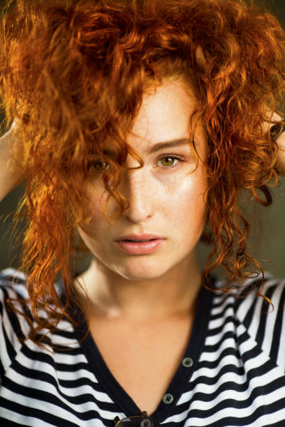 istock Young beautiful woman with ginger hair 1006114860