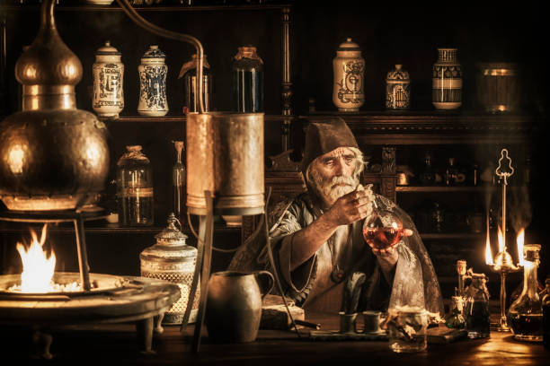 The Alchemist Medieval alchemist in his laboratory wizard photos stock pictures, royalty-free photos & images