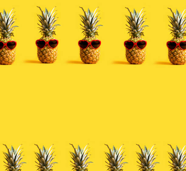 istock Series of pineapples wearing sunglasses 1006125368