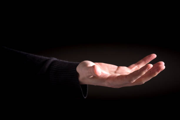istock Man holding his hand and showing something 1006125444